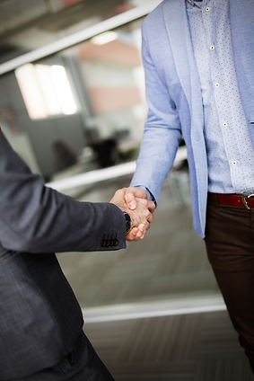business-people-shaking-hands-finishing-up-meetin-2025-03-16-07-00-23-utc.jpg