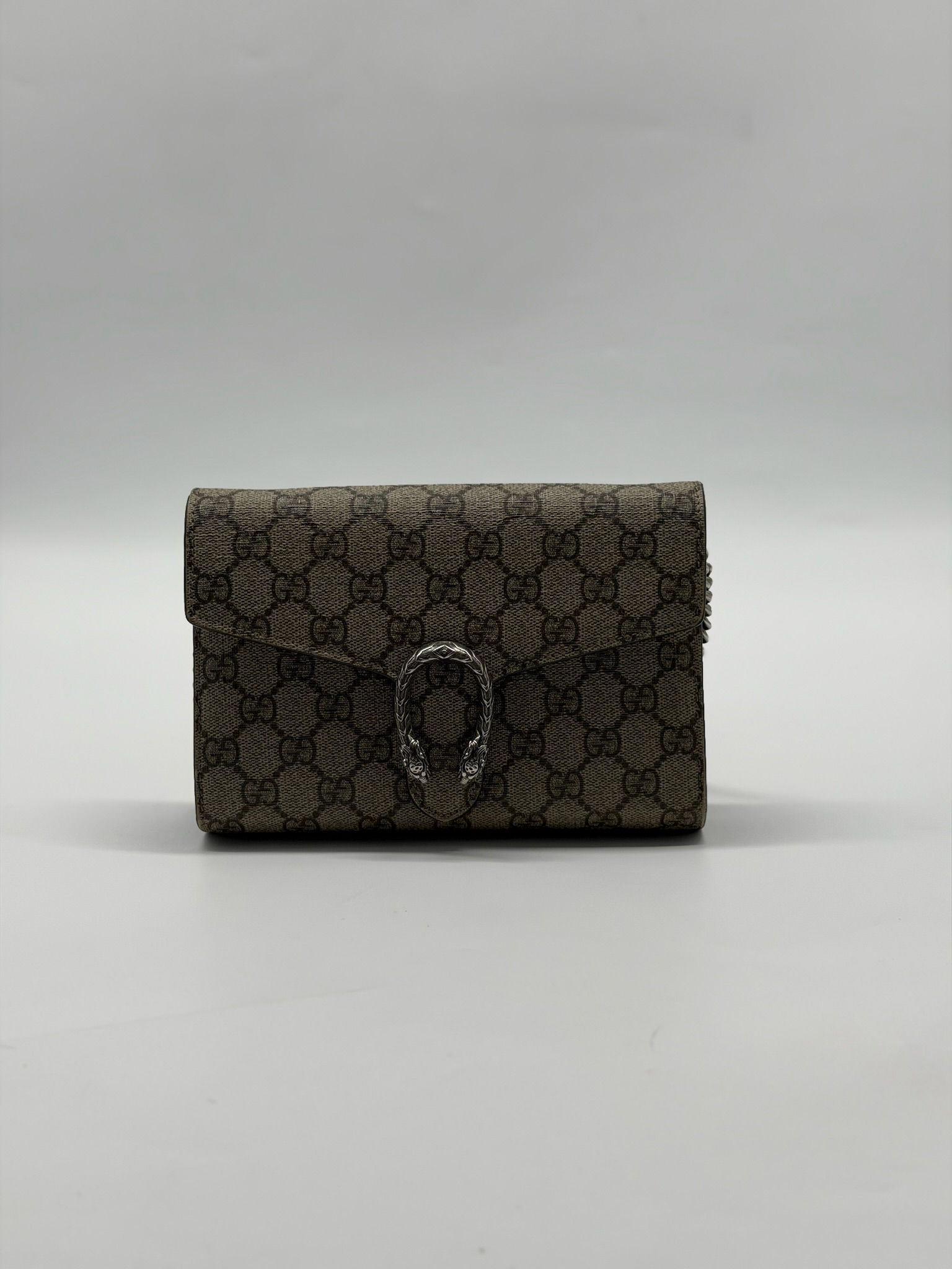 Gucci Dinoysus Monogram Wallet on a Chain.