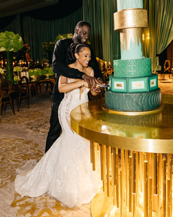 Draymond Green and Hazel Green cut their wedding cake at wedding reception at Grand Del Mar