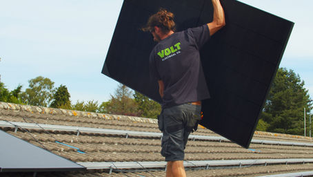 Volt electrical electrician carrying a solar panel