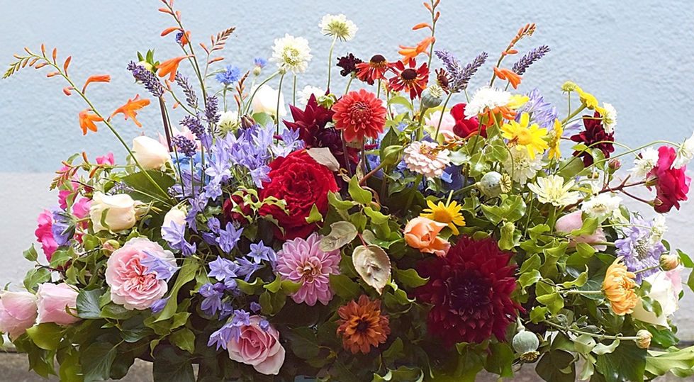 Garden flowers locally grown funeral coffin spray Torquay Devon