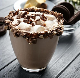 Colorful Luxe Daqs handcrafted cocktails and frozen drinks on modern bar counter.