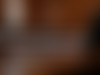 County officials listening to a fiscal briefing on preventable disease costs, housing instability, audit readiness, and local budget pressure during a government meeting.