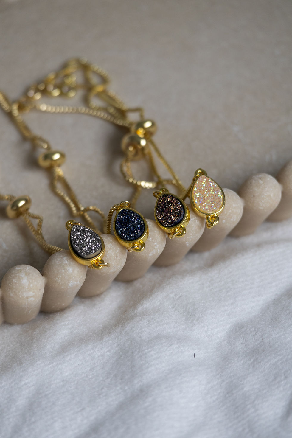 Thumbnail: Four Indigo Drop druzy bracelets in varied colors