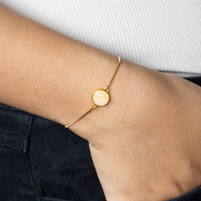 Gold chain bracelets with elegance on a person's wrist