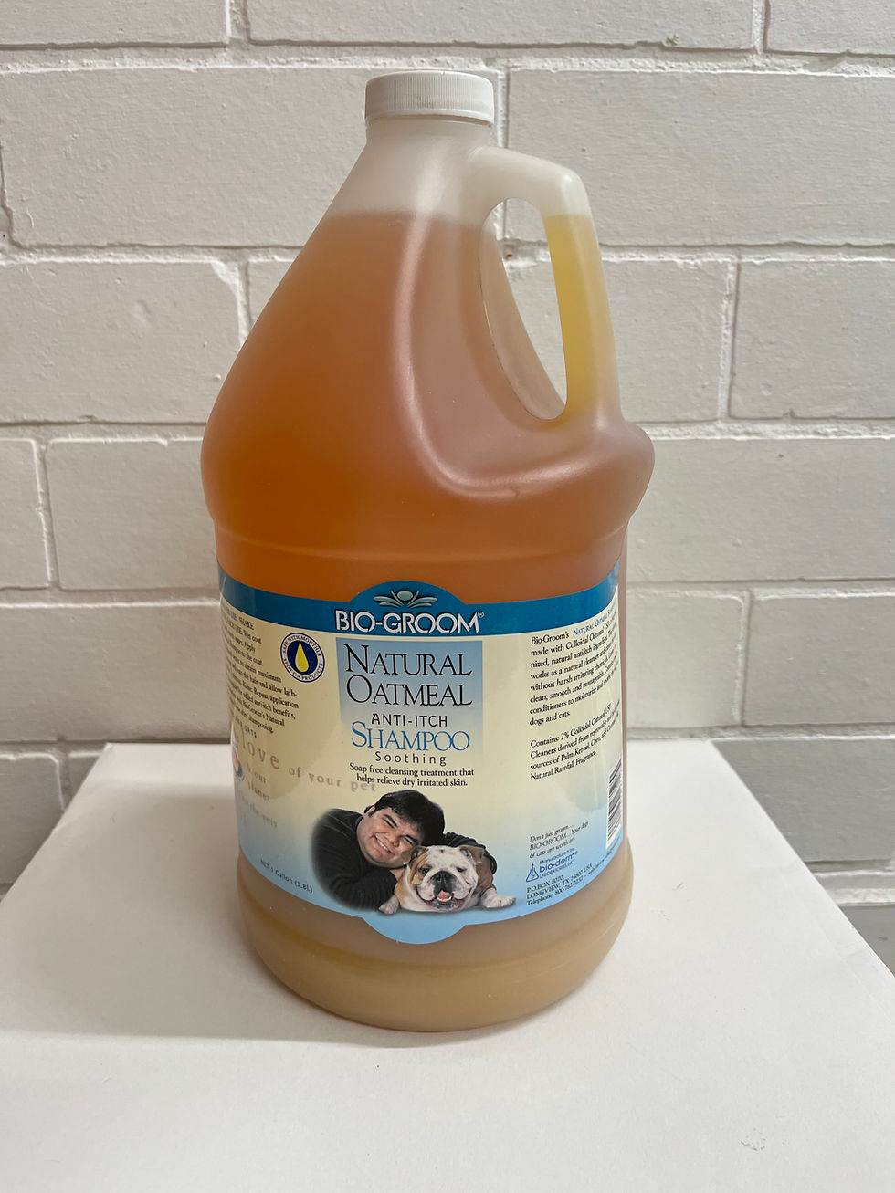 Bio-Groom Natural Oatmeal Shampoo with owner and happy dog, ready for washing.