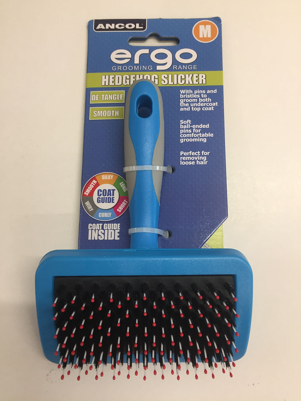 Thumbnail: Blue Ergo Hedgehog Slicker brush with ANCOL label and medium size indicator.