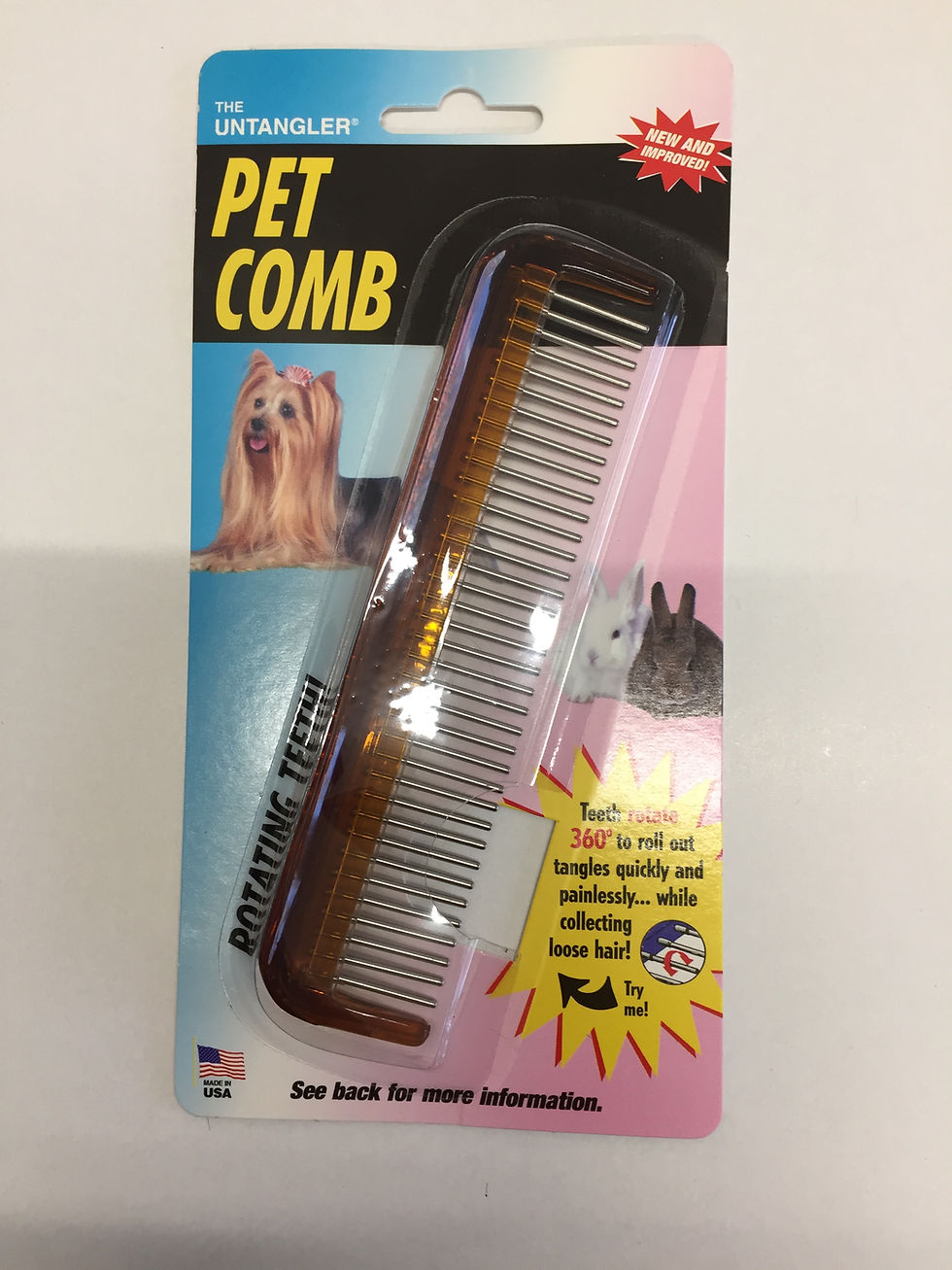 Thumbnail: Pet comb package with rotating teeth, text, and photos of pets.