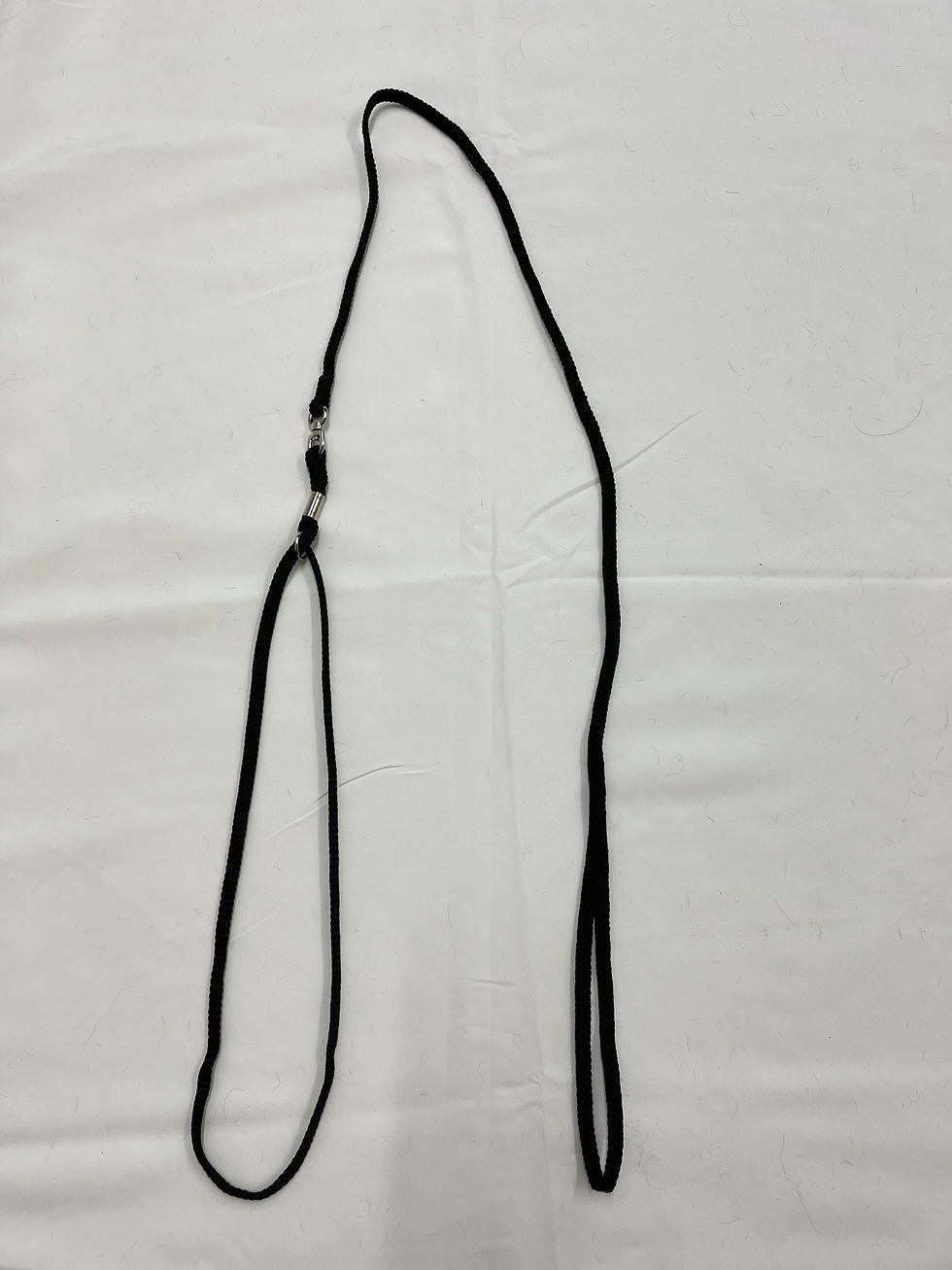 Thumbnail: Black leash on white background, ready for a dog's collar accessory.