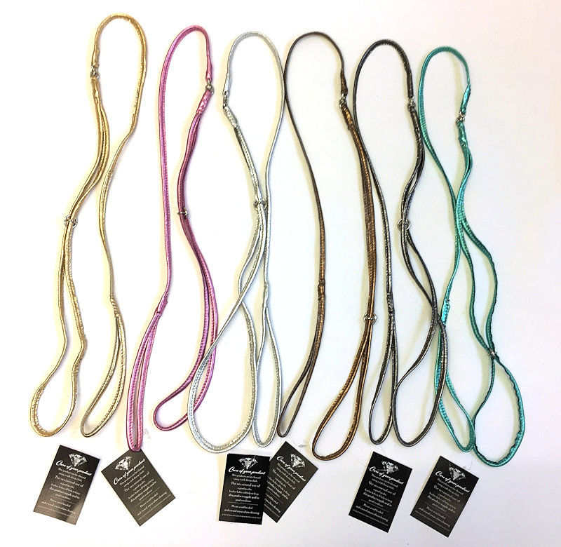 Various colored dog leashes displayed with tags, ready for sale at Top Dog Show Supplies.