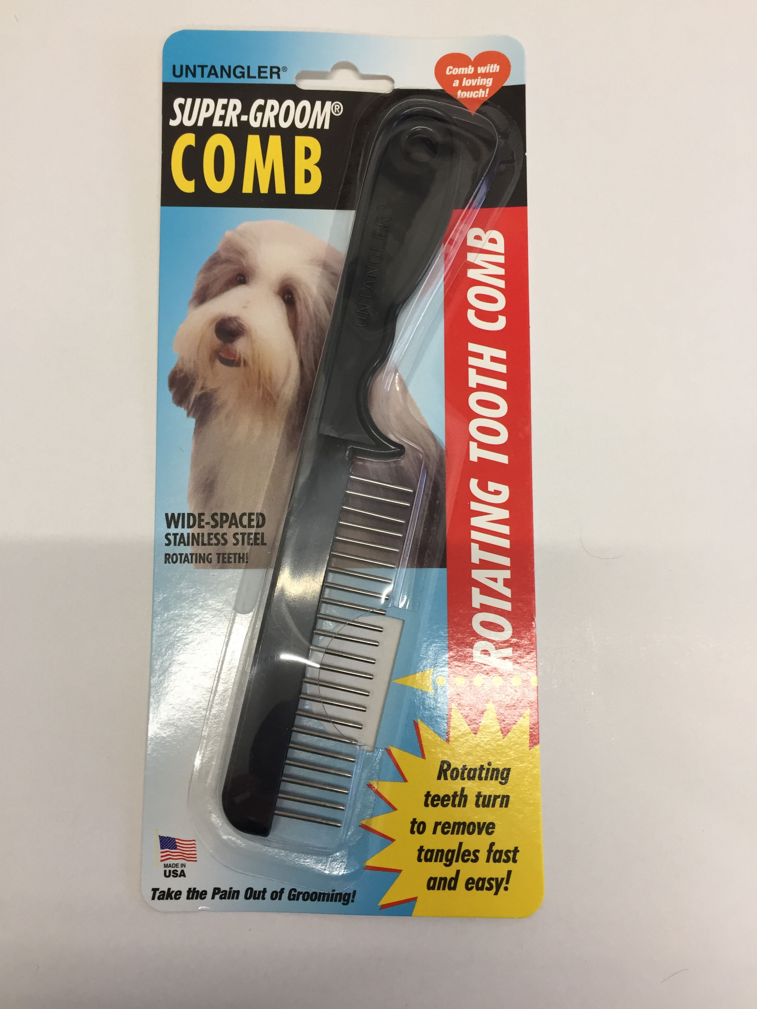 Rotating Tooth Comb package with dog, wide spaced stainless steel teeth.
