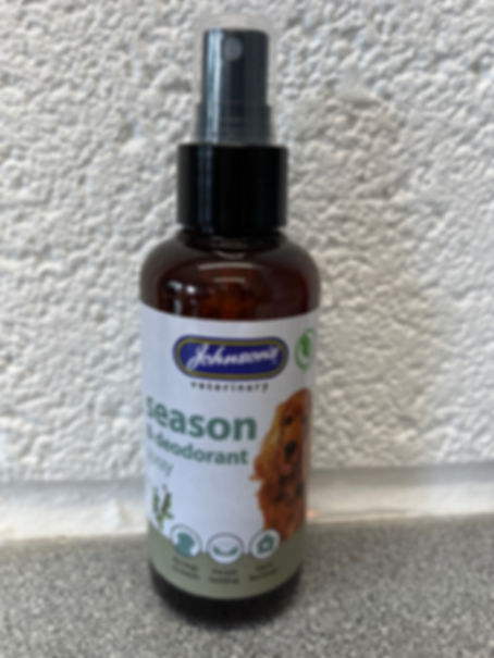 Johnson's veterinary season and deodorant spray. Brown bottle on white background.