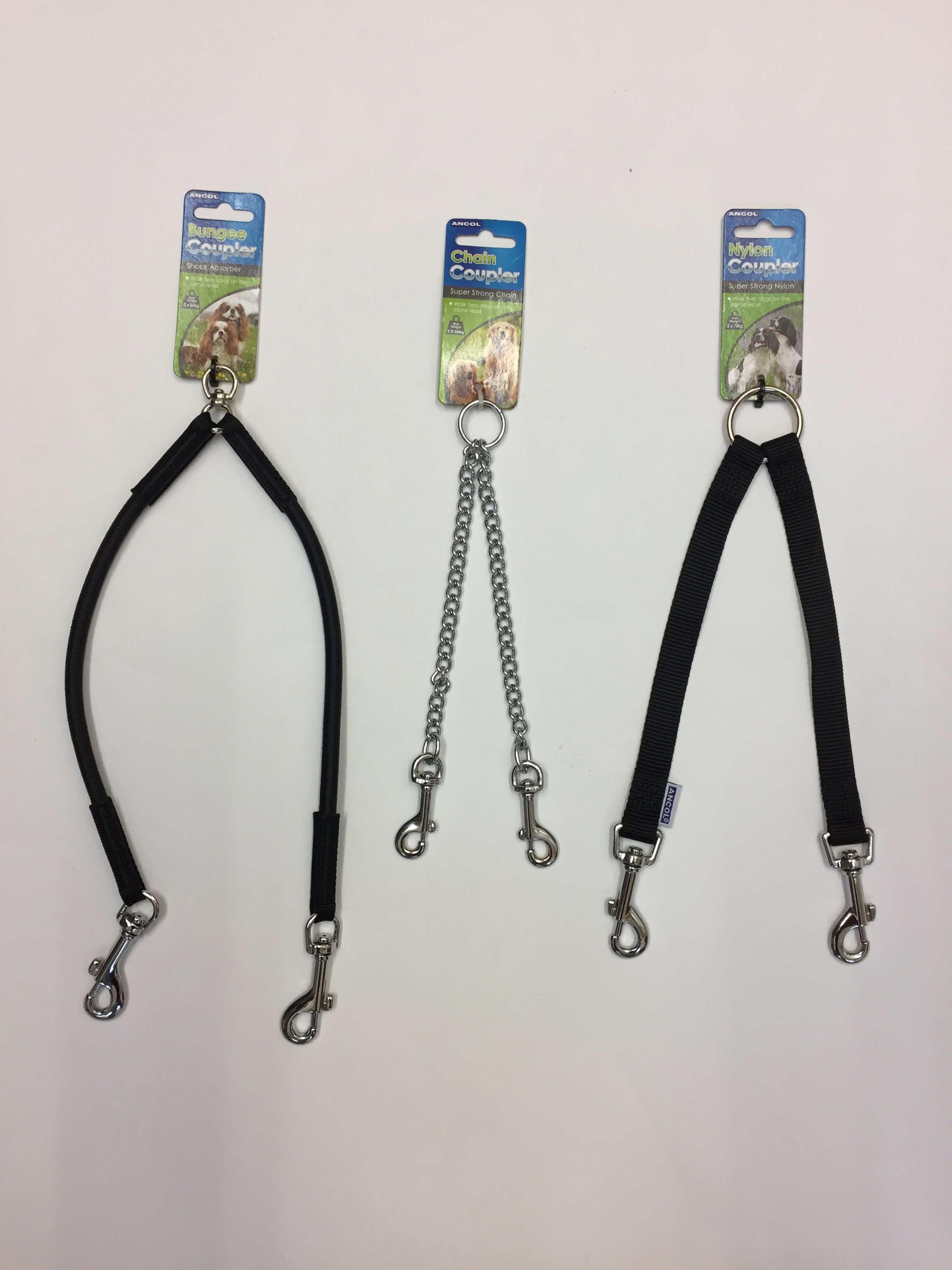 Three Ancol Couplers leashes hanging on a white background, ready to use.