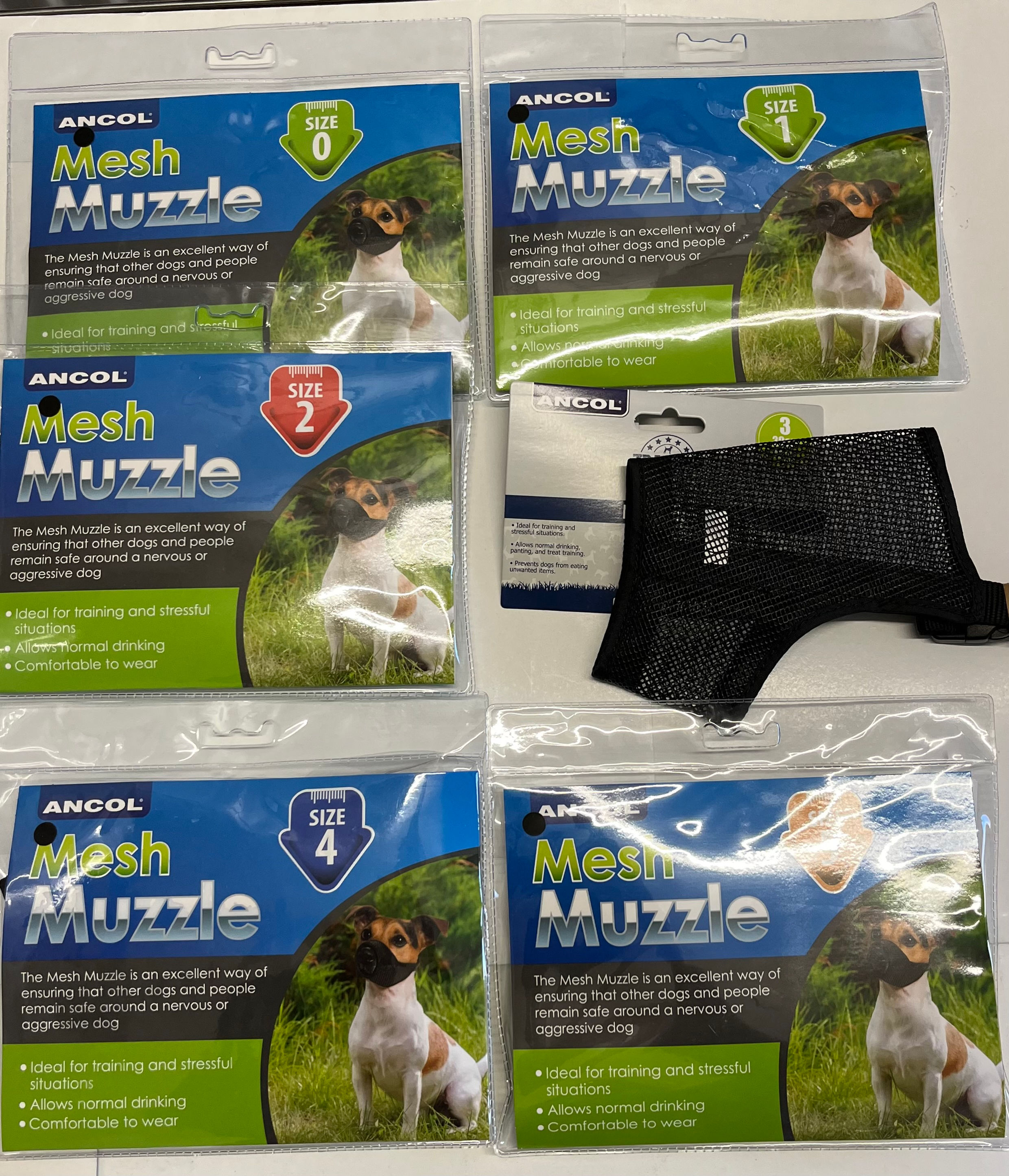 Various ANCOL Mesh Muzzle packages and a single muzzle, sizes 0, 1, 2, and 4.