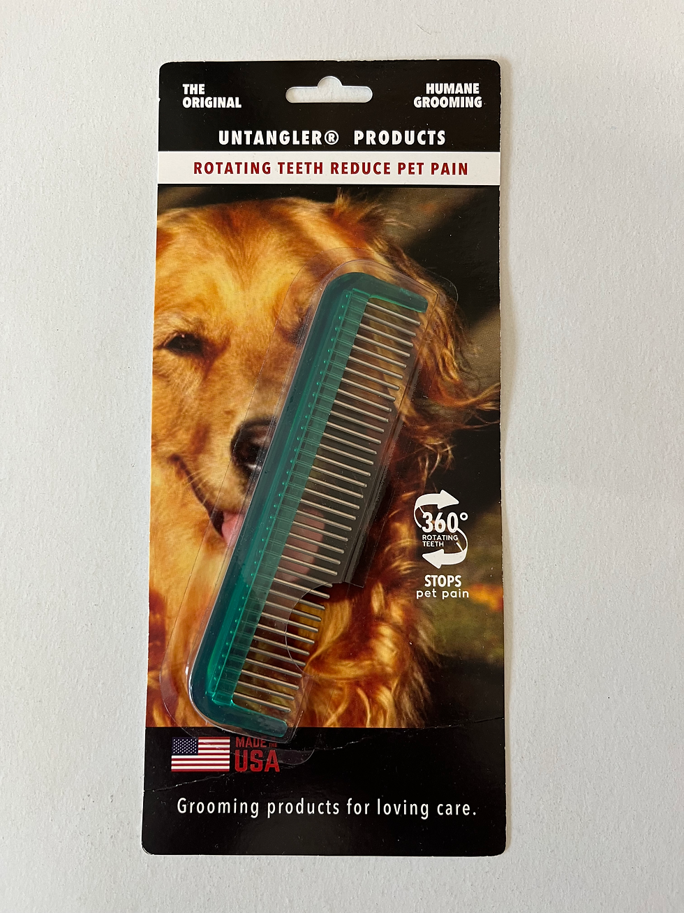 Thumbnail: Untangler Products grooming comb on a background with a golden retriever.