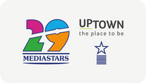 Badge Mediastars edizione 29 con stella decorativa e logo Uptown – The Place to Be. Premio ottenuto da Absoluta per il progetto realizzato per Uptown.