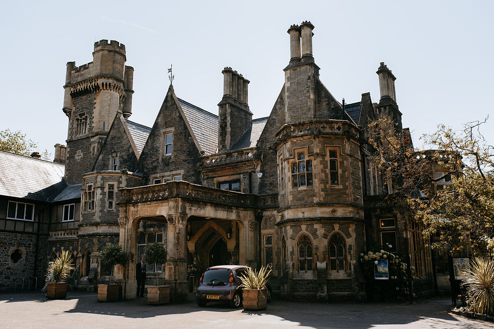Historic charm of Insole Court, a stunning Victorian mansion with intricate architectural details, nestled amid lush greenery.