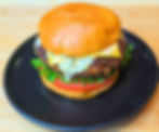 A side by side gallery image showing the "She Draws It, I Cook It" concept. On the left is an imaginative, colorful childhood drawing of Spongebob, Plankton, and a Krabby Patty. On the right is a vibrant, professional photograph of the real life food creation cooked from scratch to perfectly mimic the shape and style of the sketch.