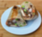 A side by side gallery image showing the "She Draws It, I Cook It" concept. On the left is an imaginative, colorful childhood drawing of a Panda Burrito. On the right is a vibrant, professional photograph of the real life food creation cooked from scratch to perfectly mimic the shape and style of the sketch.