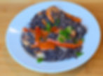 A side by side gallery image showing the "She Draws It, I Cook It" concept. On the left is an imaginative, colorful childhood drawing of a gothy bowl of noodles. On the right is a Wednesday Addams inspired, professional photograph of the real life food creation cooked to perfectly mimic the shape and style of the sketch.