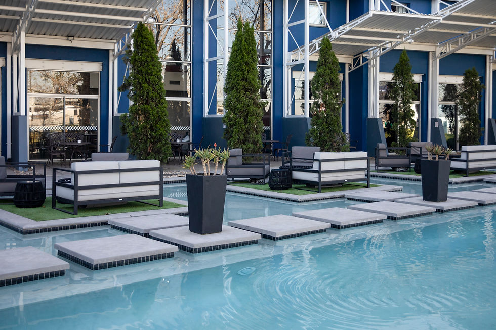 Swimming pool and sofas in the comfort and relaxation area of a 5 star quality hotel in th