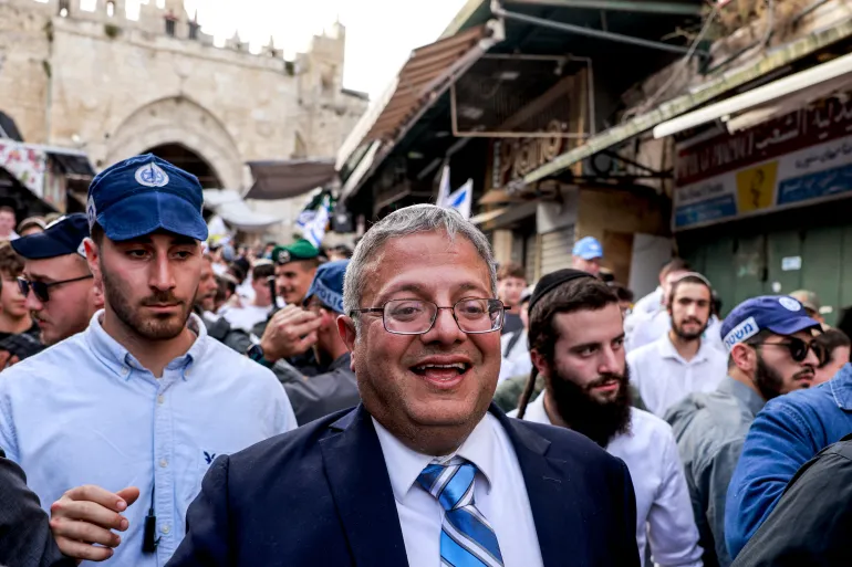 Israeli policemen escort Israeli Minister of National Security Itamar Ben-Gvir as he walks through the Old City of occupied East Jerusalem, on May 26, 2025 (Menahem Kahana | AFP)