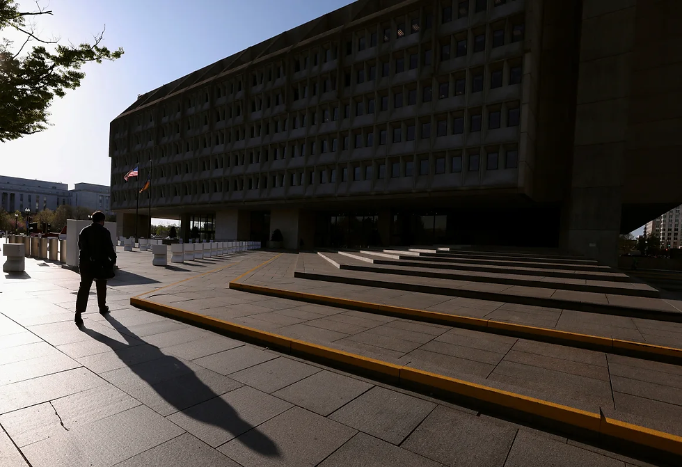 A man walks toward the headquarters of the Department of Health and Human Services (HHS) in Washington, DC, April 1, 2025. (Kevin Lamarque | Reuters)