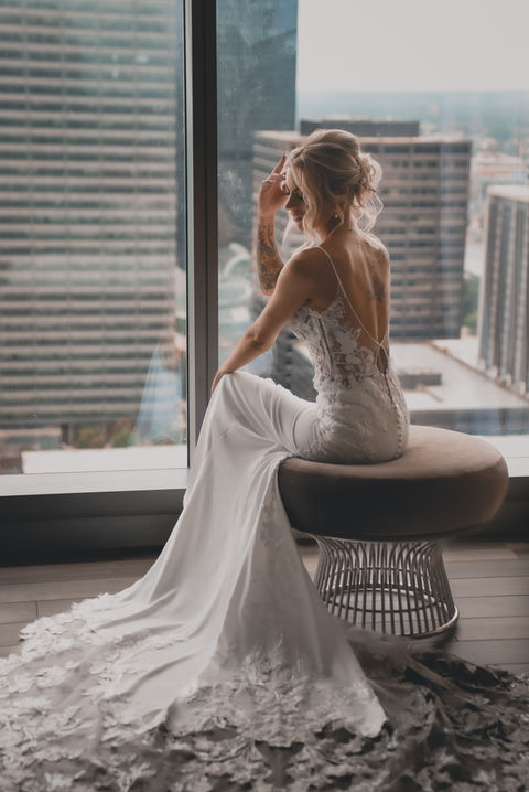 Bride getting ready in her hotel room in downtown Cleveland with April G Photography. Getting ready photos with the Bride in the bridal suite with April G Photography.,destination wedding, dark & moody wedding photographer, moody photographer, April G Photography, dark & Moody wedding photographer, best wedding photographer in cleveland, best wedding photographer in ohio, editorial wedding photographer,  romantic wedding photographer, unique wedding photographer,  medina weddings, akron weddings,  cleveland weddings, experienced wedding photographer, destination wedding photographer,  elopement wedding photographer