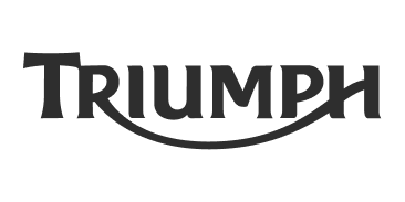 Triumph logo in grey on black background, showcasing the brand name.