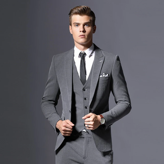 Classic grey three-piece suit with peaked lapel
