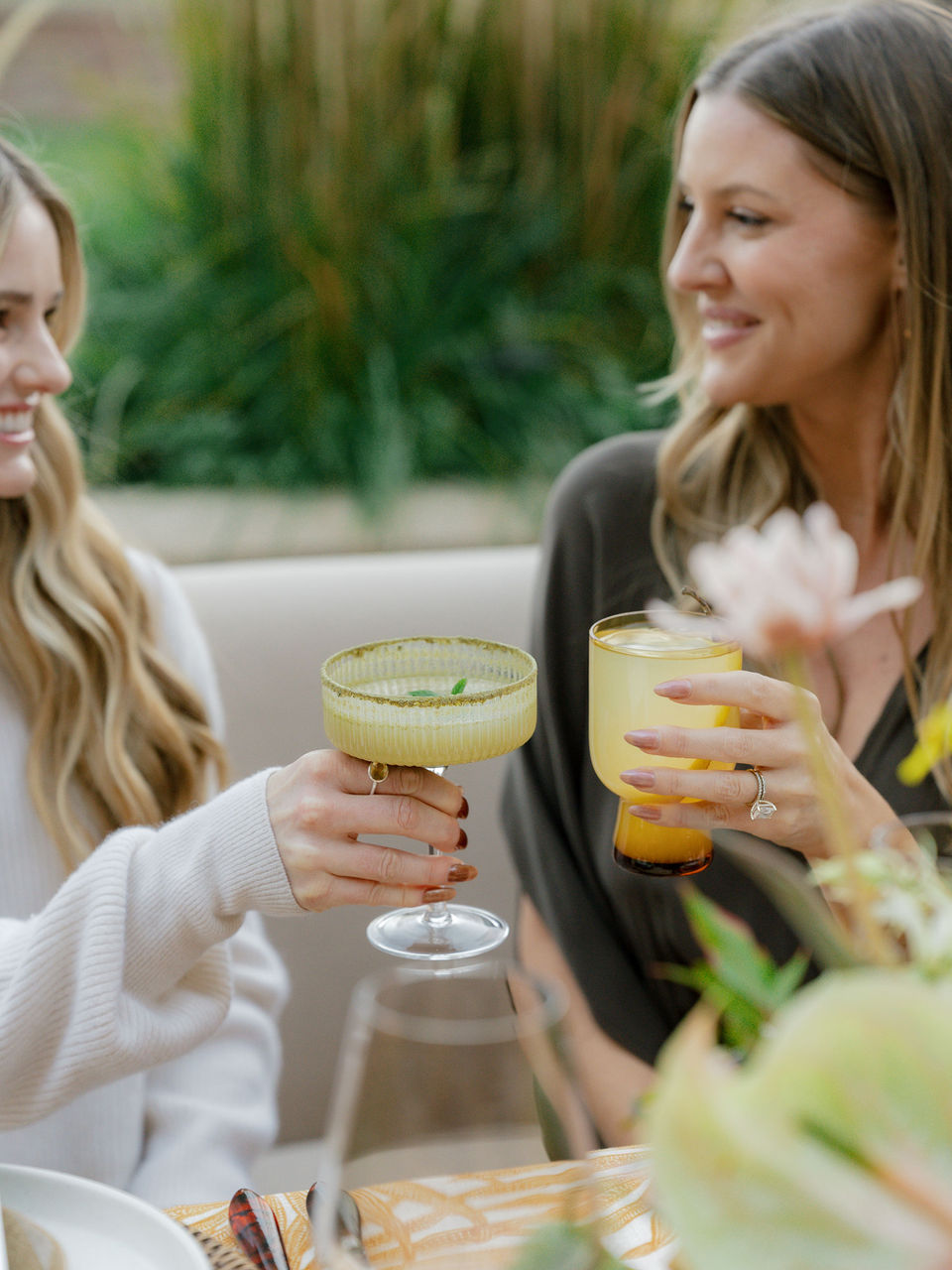 guests cheers with cocktails at a colorado Dinner Party