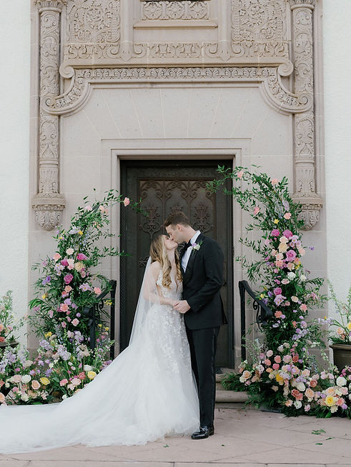 couple kissing at their wedding planned by Marigold Events