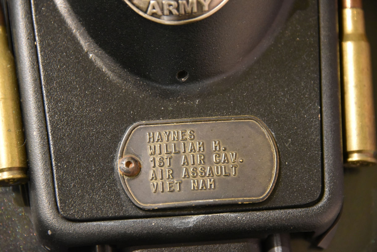 Close-up view of Roger E. Ward dog tag