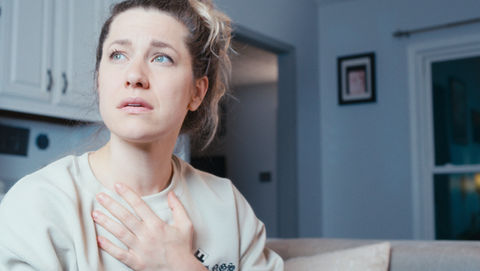 Cinematographer working with shallow depth of field to highlight emotion in scene