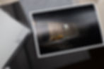 Printed photo of a yellow taxi on a dark rainy street, beside envelopes labeled LUX Photo Lab.