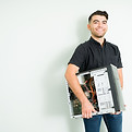 happy-technician-feeling-excited-while-carrying-repaired-cpu-computer-give-it-customer-his