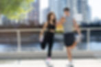 two people doing sports warm up