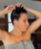 Woman putting her hair up