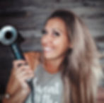 Woman holding blow dryer