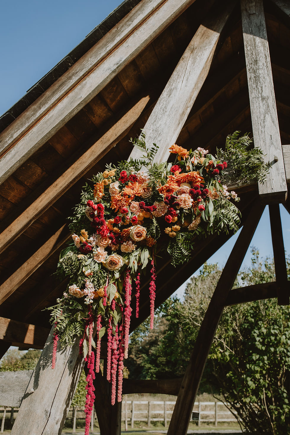 Outdoor ceremony arch floral display