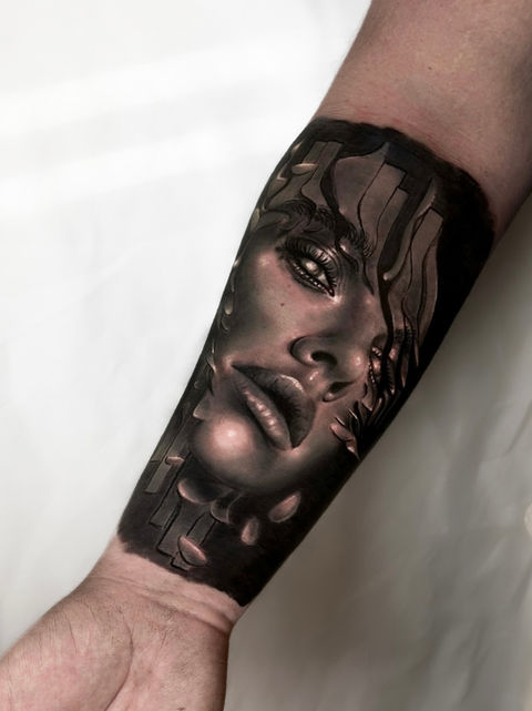 surrealistic black and grey woman tattoo