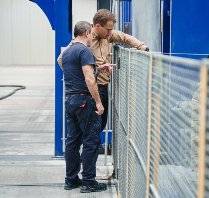 Managing director and employees check plastic sheets