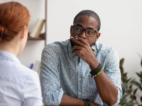 Two people talking in an office