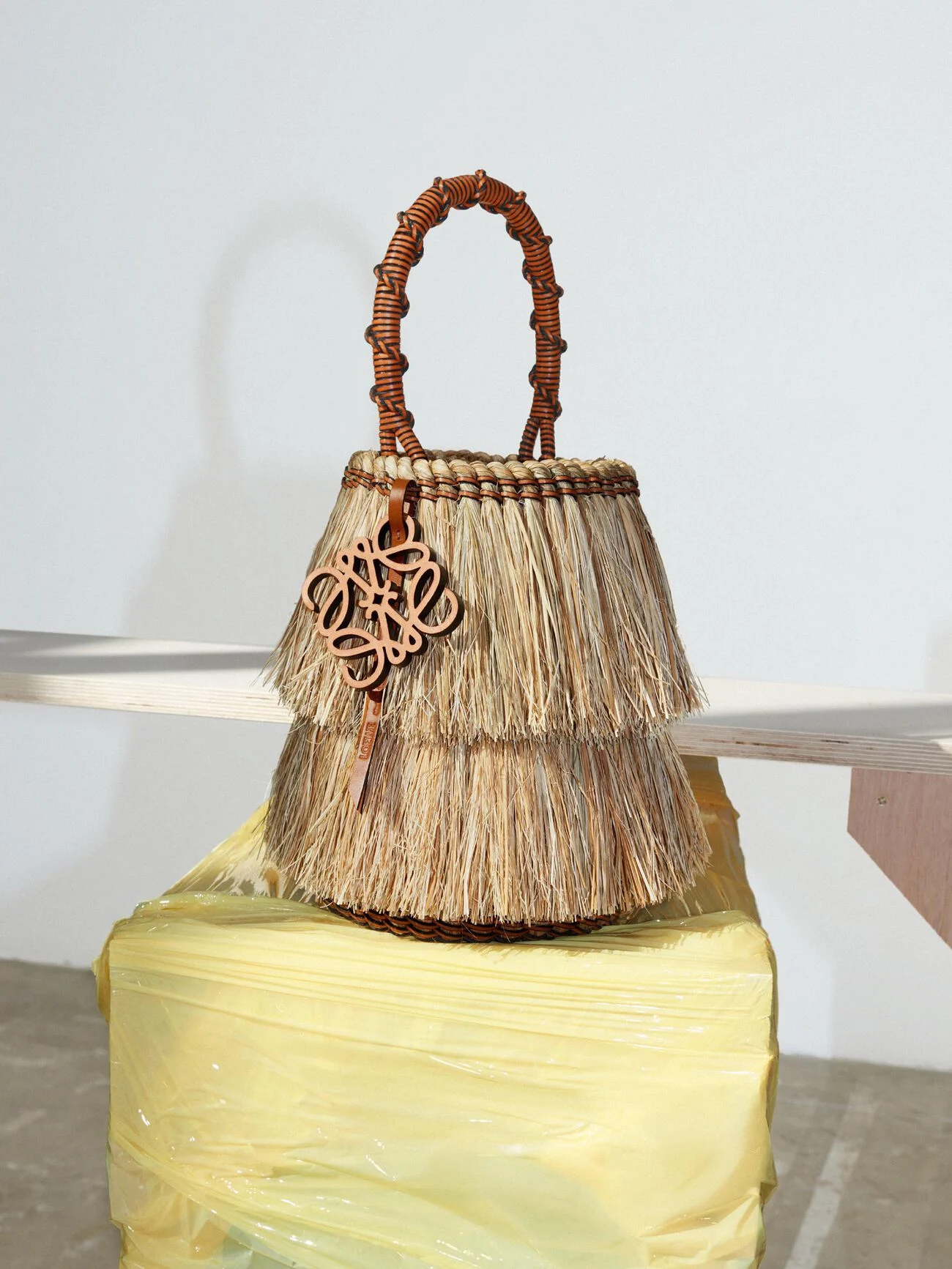 Straw and leather Loewe bag showcasing Loewe Craftsmanship.