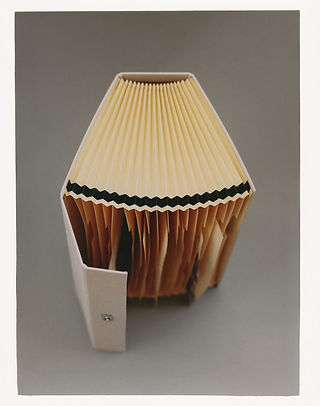 Minimalist still life by Maureen M. Evans for Zara Home — folded paper object in neutral tones.