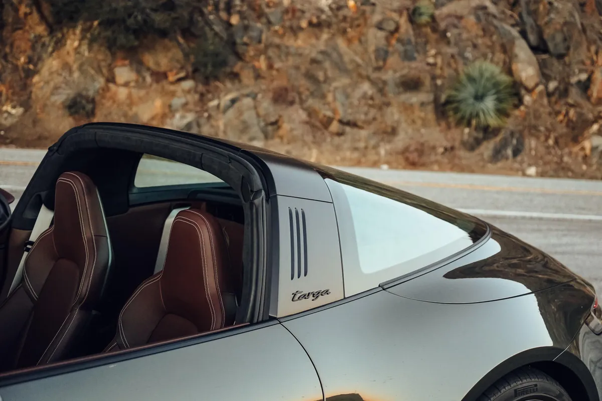 Open-roof Targa showing seats and silver hoop.