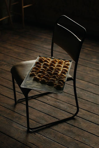 Food photography by Maureen M. Evans at Osip — tray of handmade pasta resting on a chair in soft natural light.