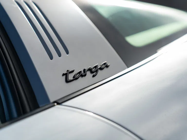 Targa badge close-up on silver hoop.