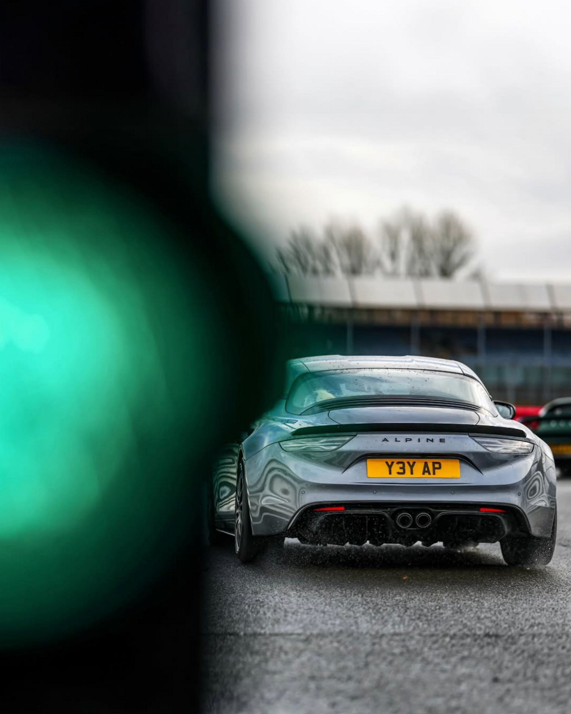 Alpine A110 rear view, lightweight mid-engine sports car in Australia