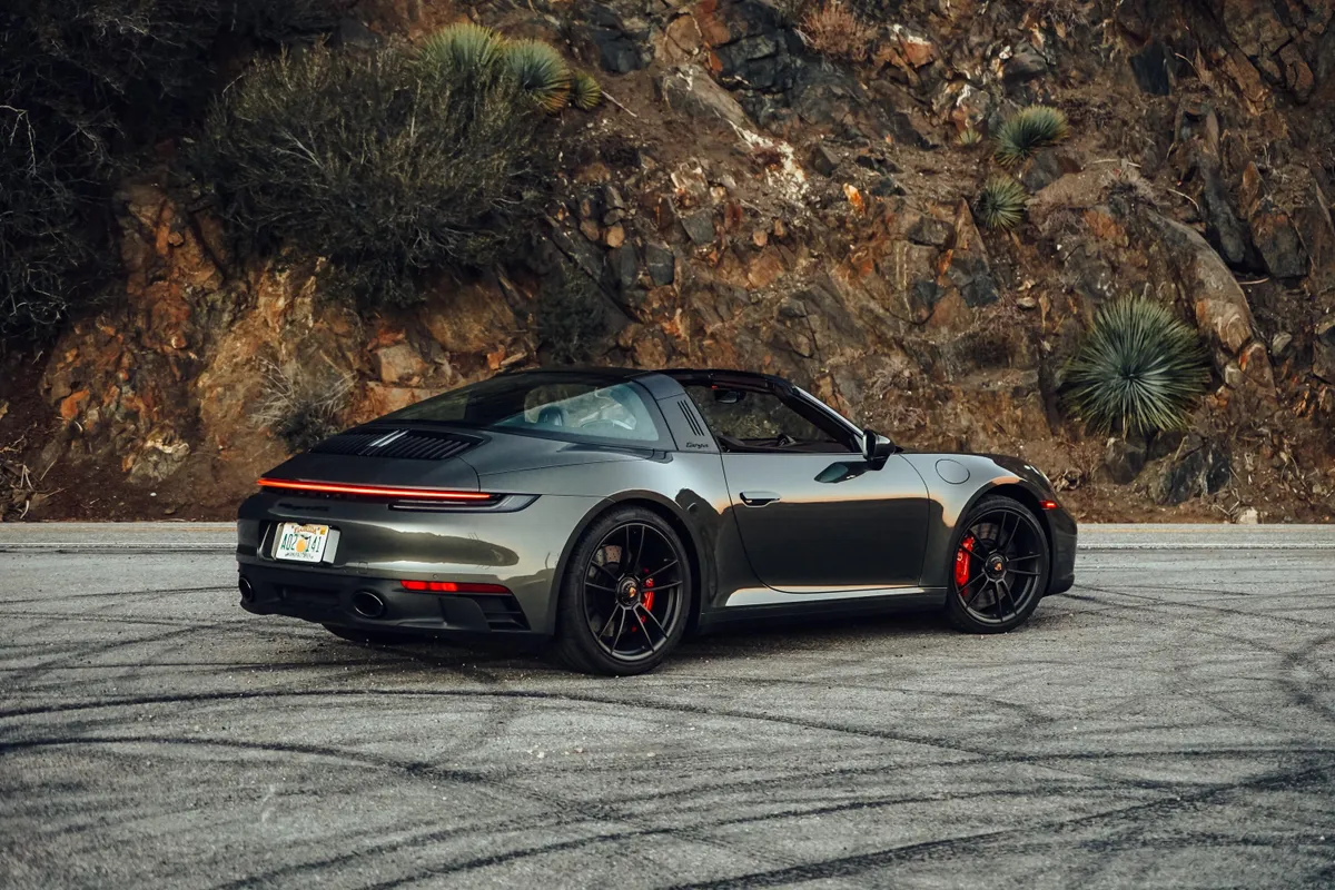 Grey Targa parked on a mountain road.